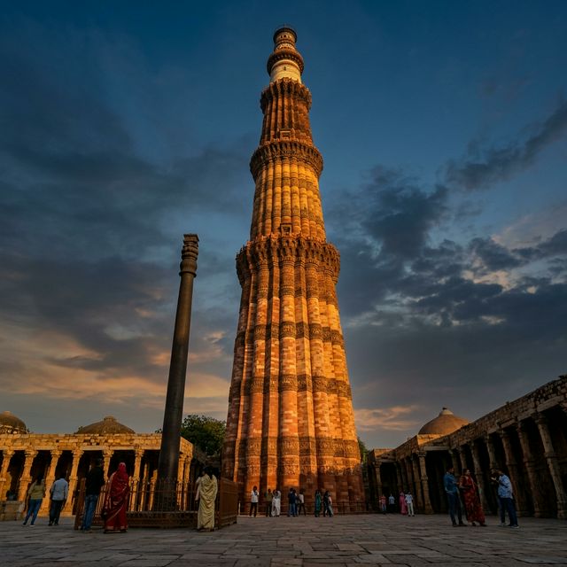 The Qutub Minar against a twilight sky